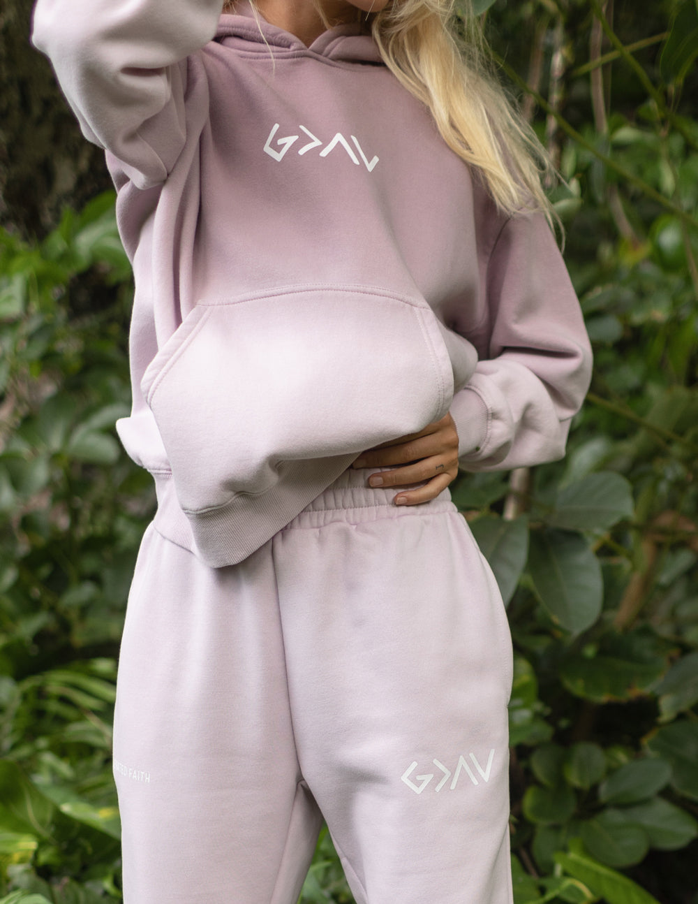 Light purple unisex sweatpants with elastic waistband and leg logo