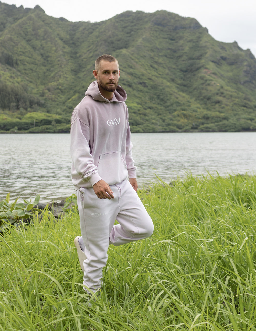 Light purple unisex sweatpants with elastic cuffs and relaxed fit