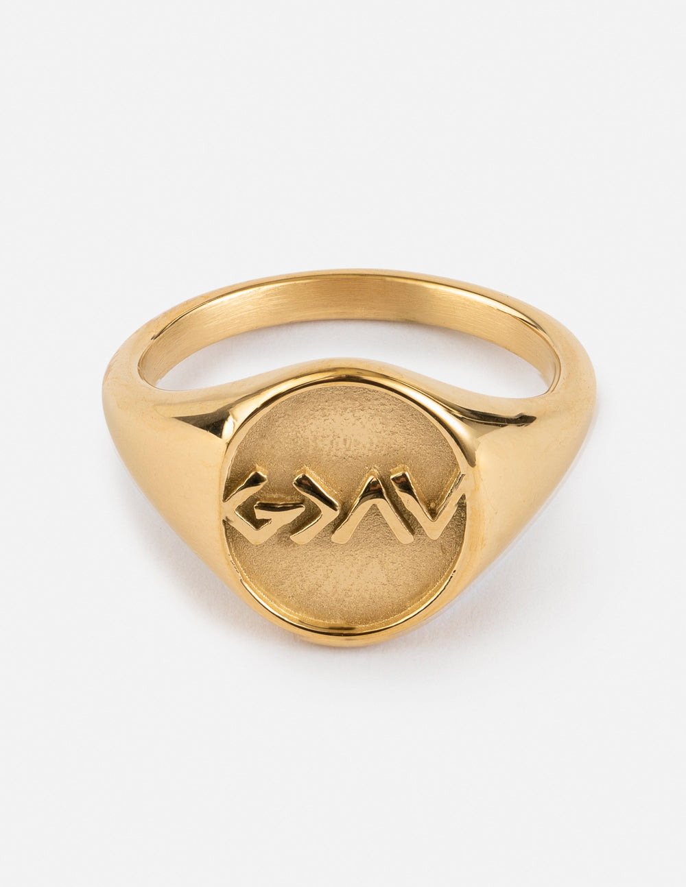 Gold-tone signet ring with engraved mountain-like design on oval face