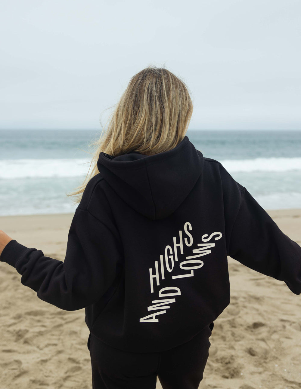 Black unisex pullover hoodie with large back logo graphic and hood