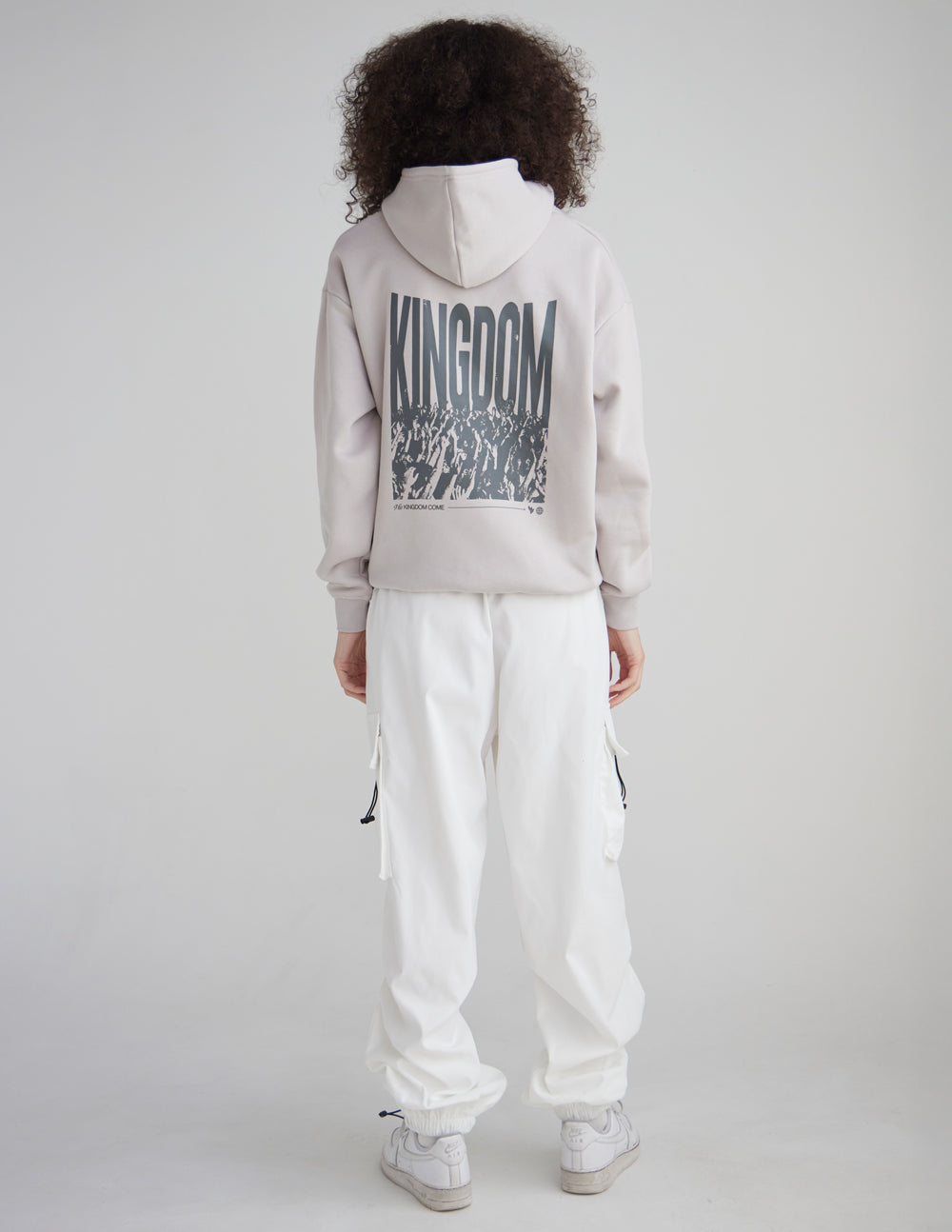 White unisex hoodie, back view with large KINGDOM graphic under hood