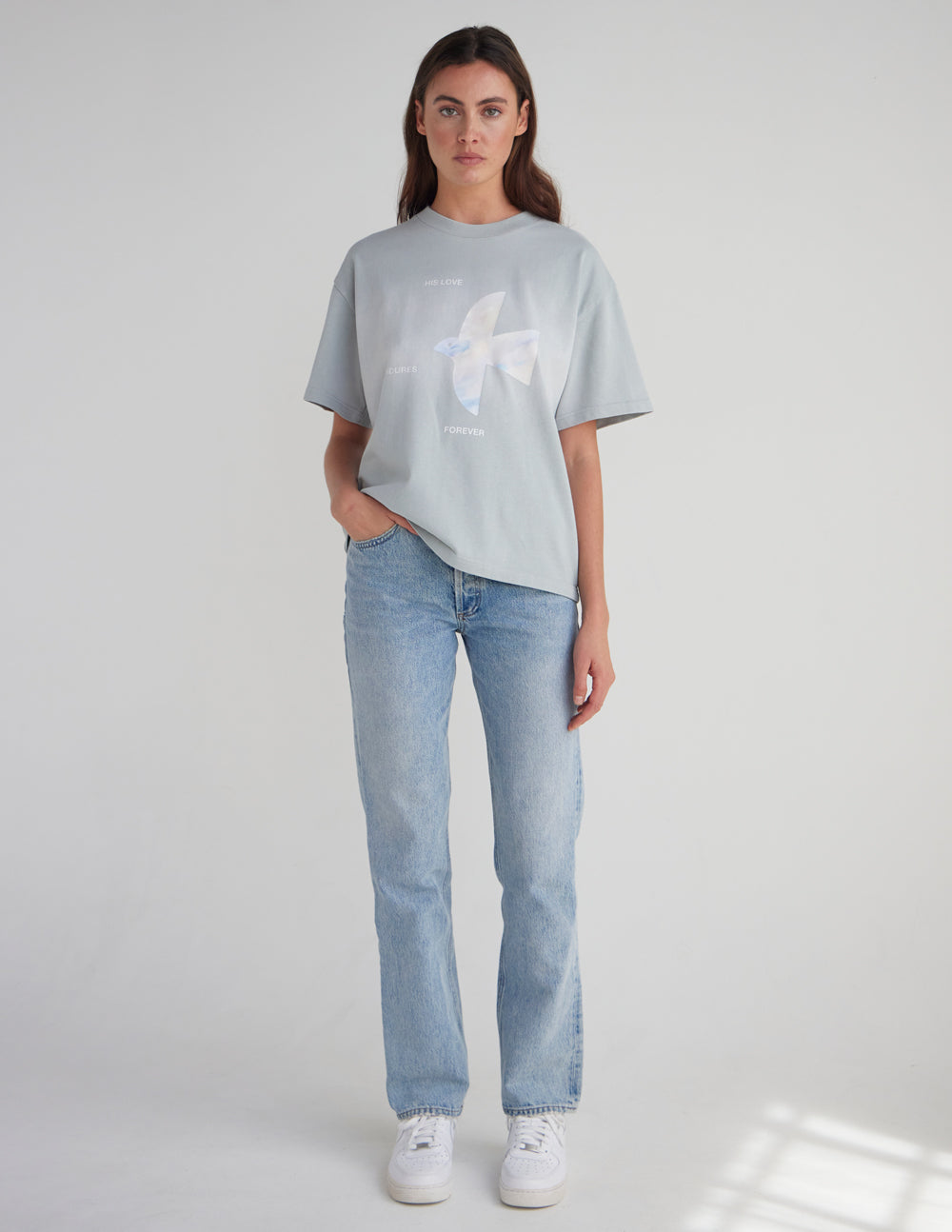 Light blue heavyweight T-shirt with white dove graphic and small text print