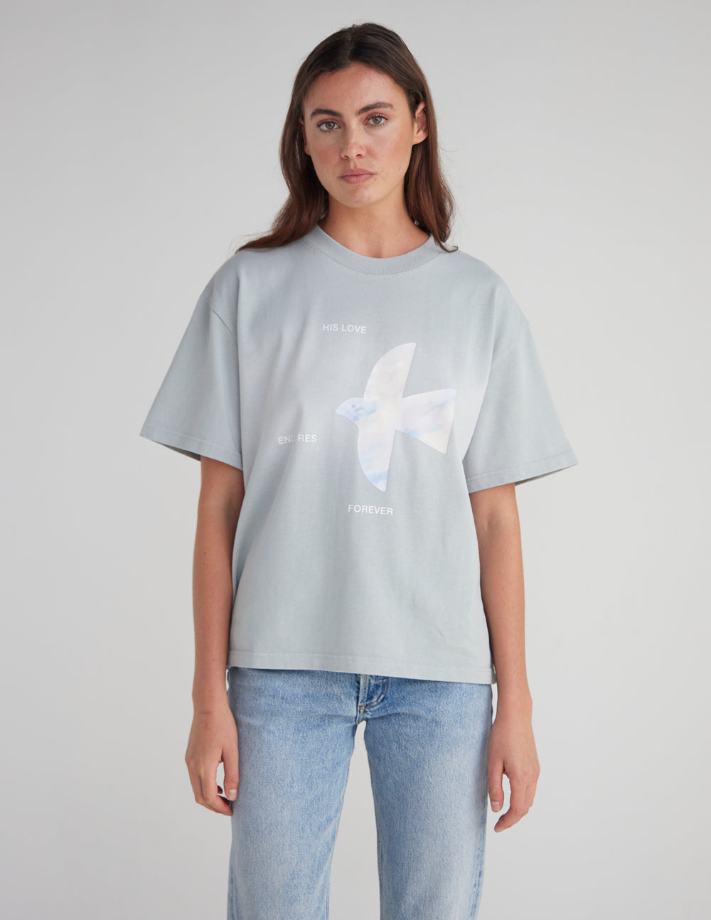 Light blue heavyweight T-shirt with white dove graphic and scattered text