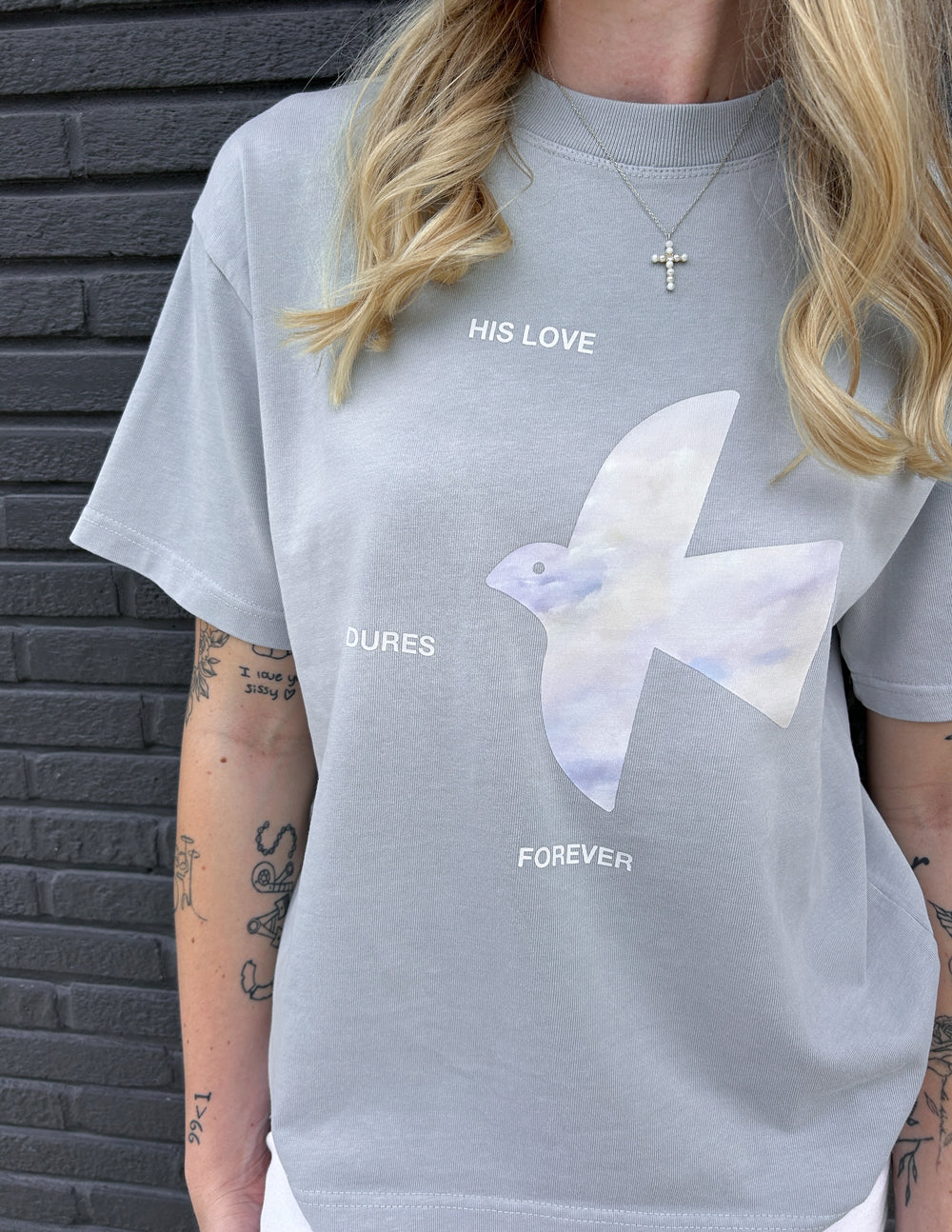Light blue heavyweight T-shirt with white dove graphic and text print