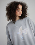 Light gray unisex crewneck sweatshirt with front angel graphic and crew neckline