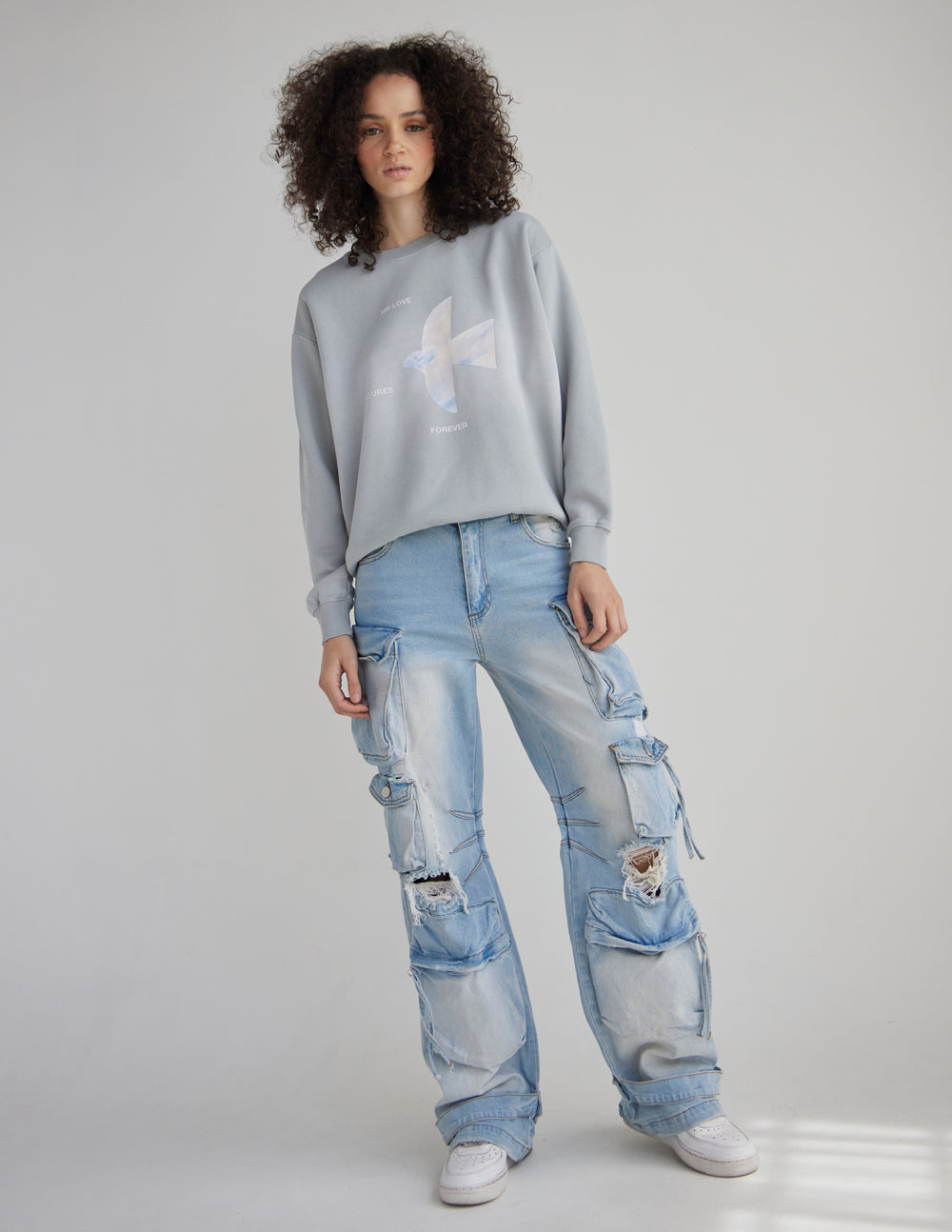 Light gray unisex crewneck sweatshirt with front angel graphic and long sleeves