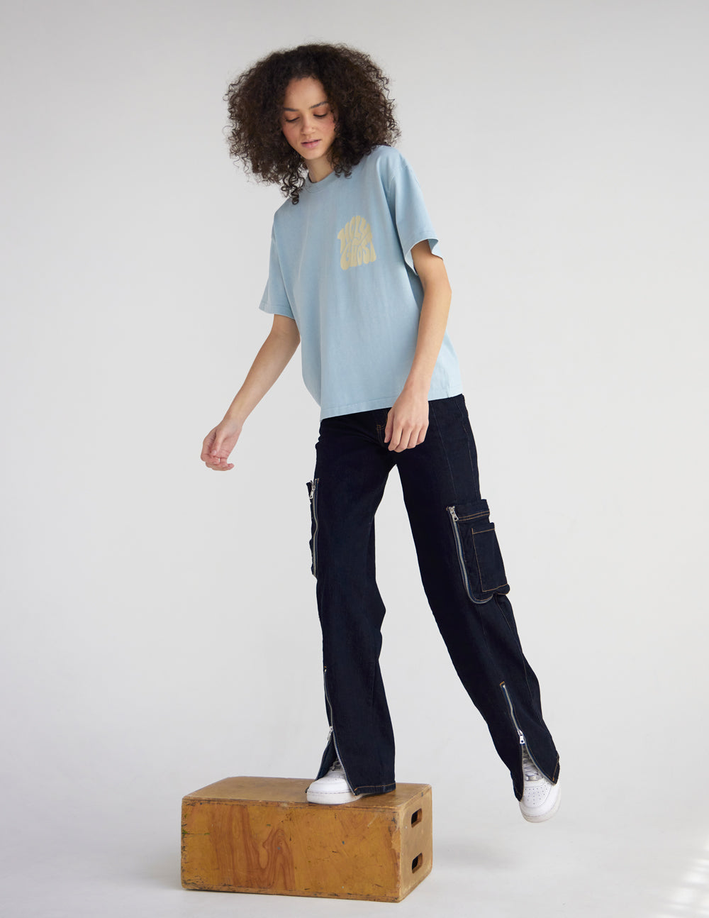 Light blue heavyweight T-shirt with front chest graphic, crew neck, short sleeves.