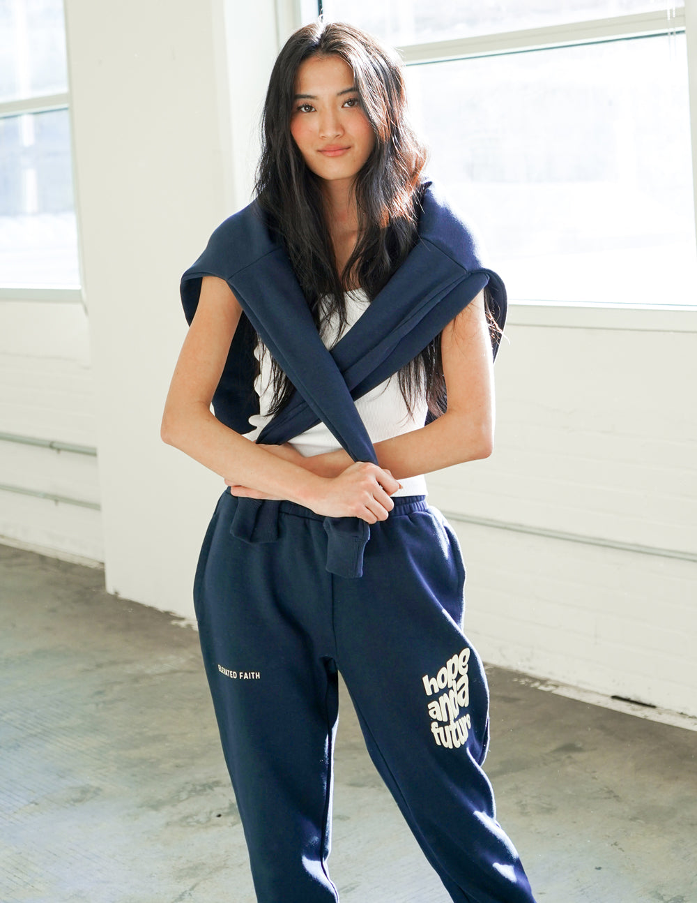 Unisex navy sweatpants with “Hope and a Future” logo printed on one leg