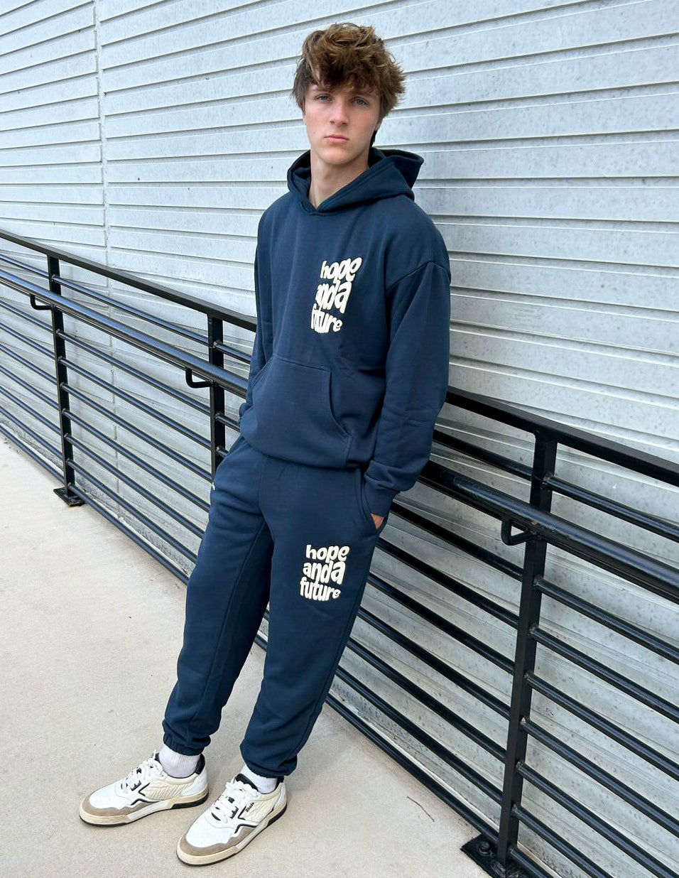 Unisex navy sweatpants with “Hope and a Future” logo on the thigh and knee