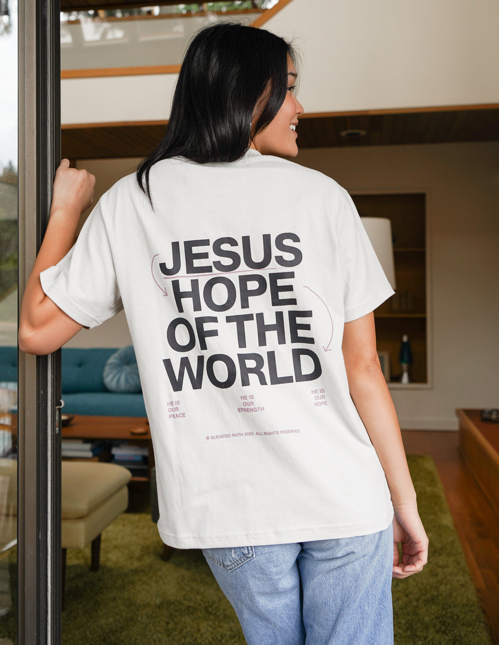 Unisex graphic tee, white, with large back text "JESUS HOPE OF THE WORLD"