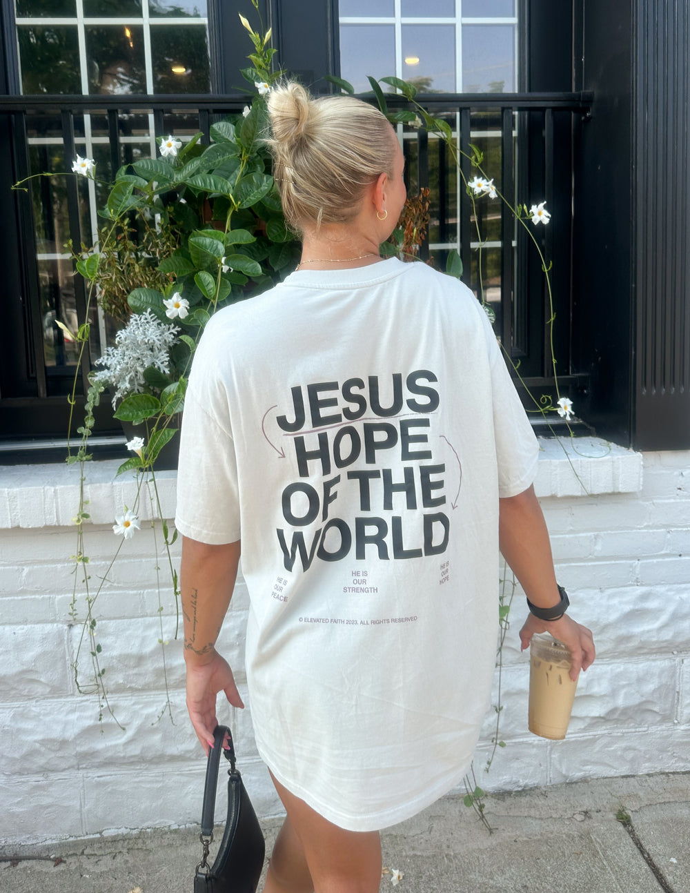 Unisex graphic tee, white, with large back print text "JESUS HOPE OF THE WORLD"