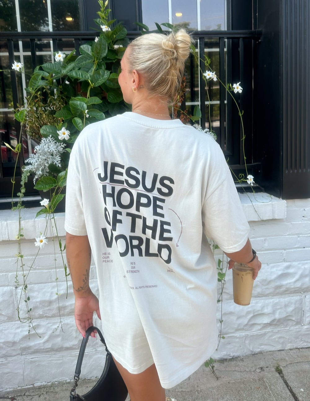 Unisex graphic tee, white, with back text "JESUS HOPE OF THE WORLD"