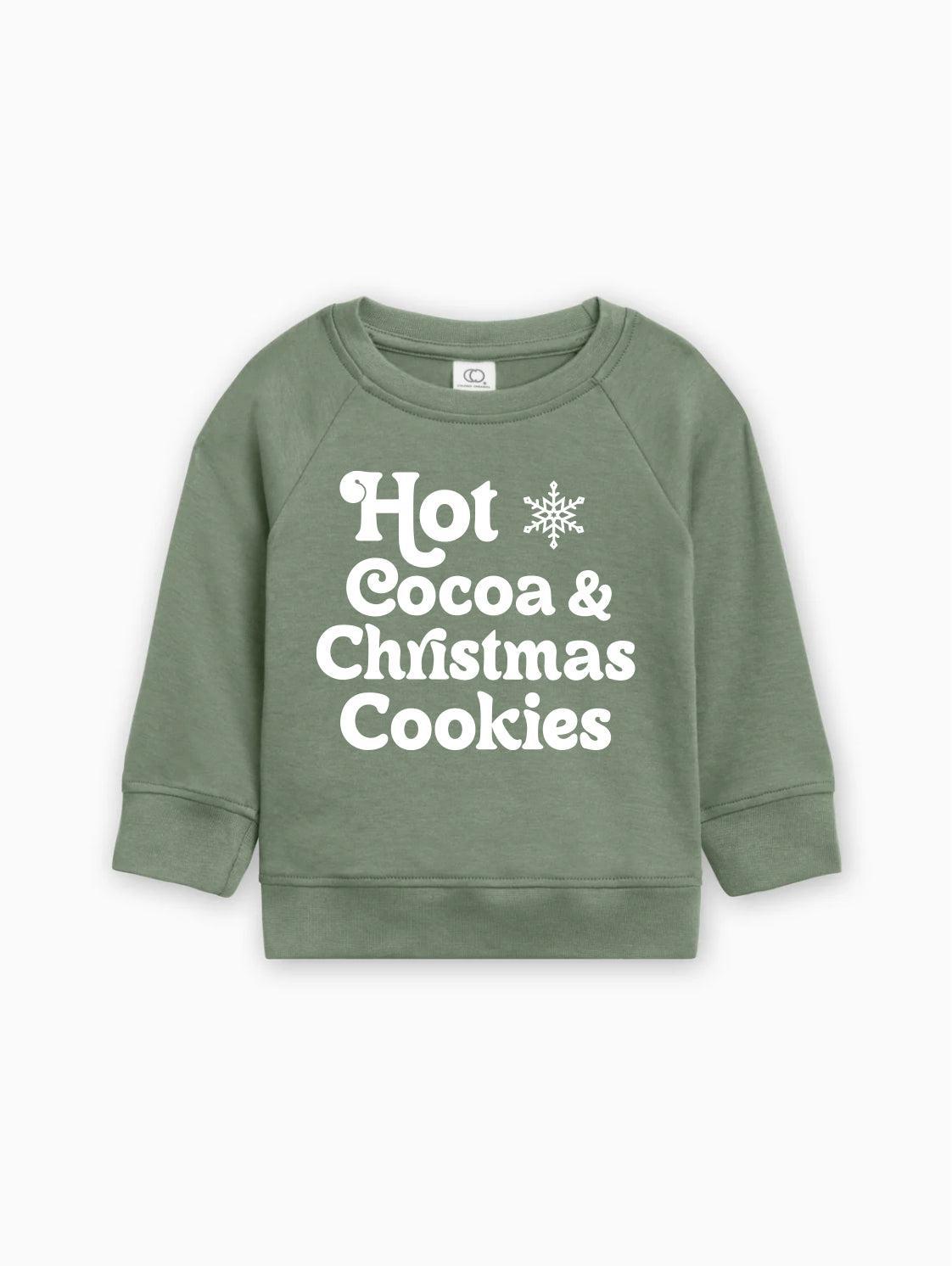 Green baby pullover with long sleeves and white "Hot Cocoa & Christmas Cookies" graphic