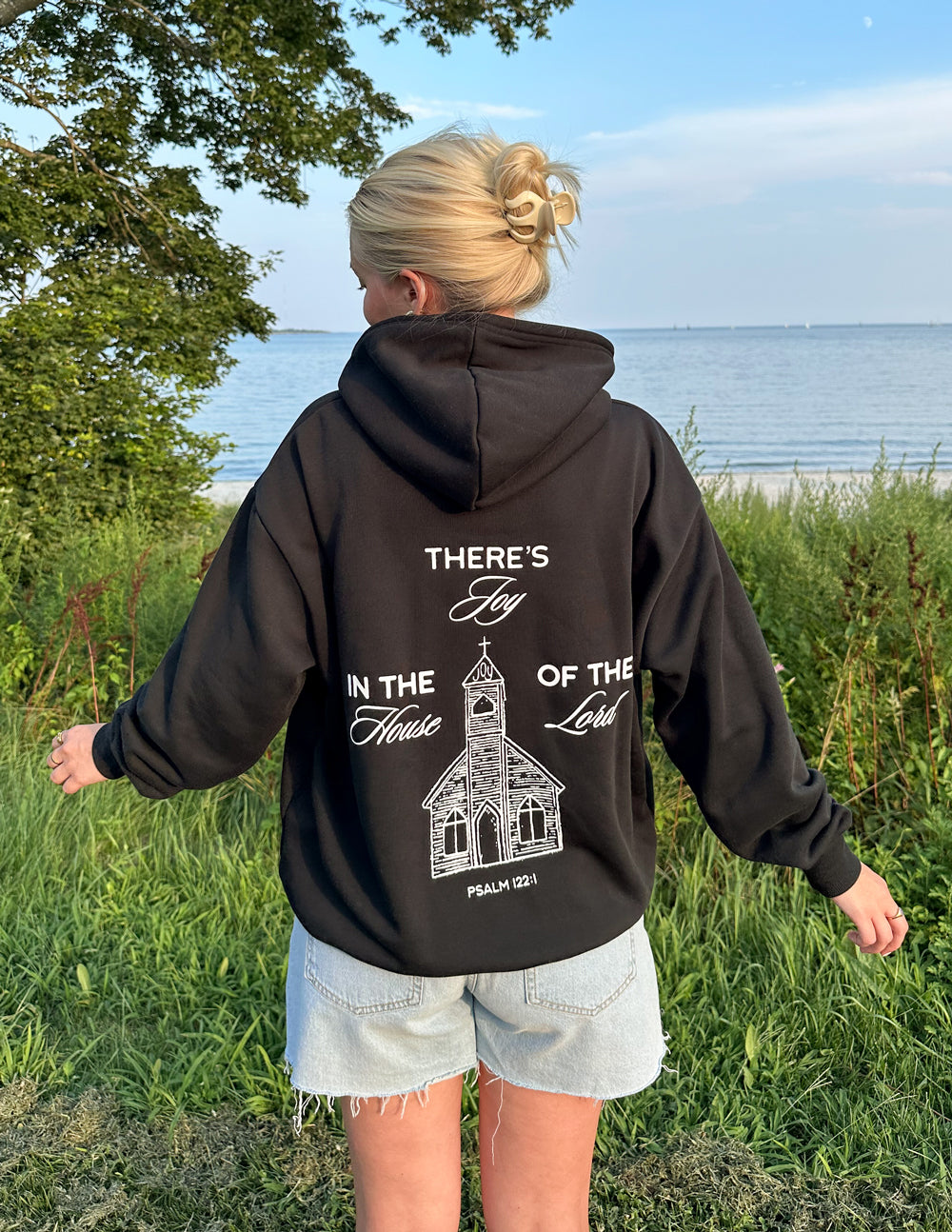 Black unisex hoodie with large back graphic print and hood