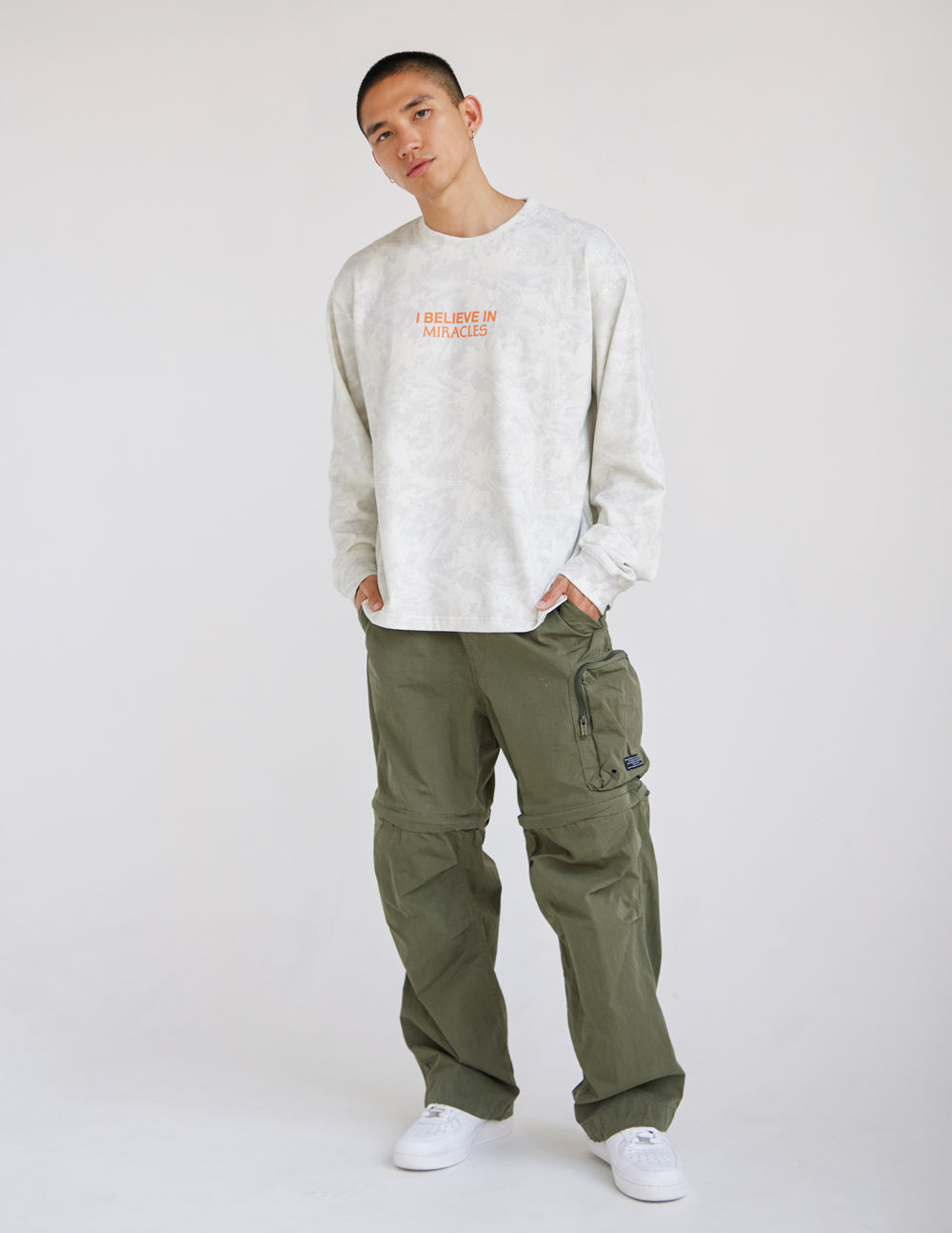 Long-sleeve heavyweight tee in white with orange front logo text