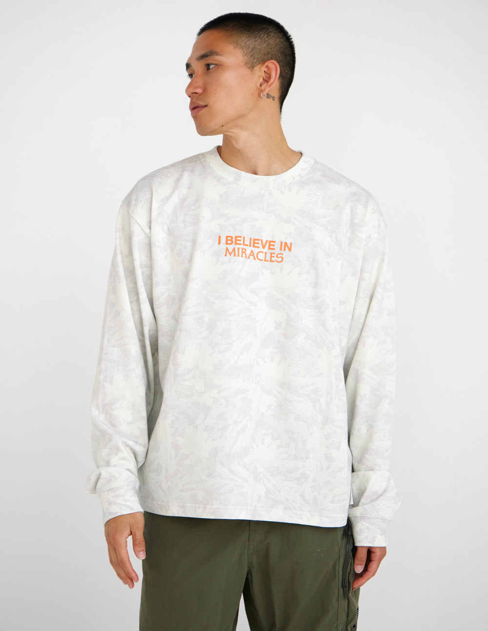 Long-sleeve heavyweight tee in white with orange front logo text