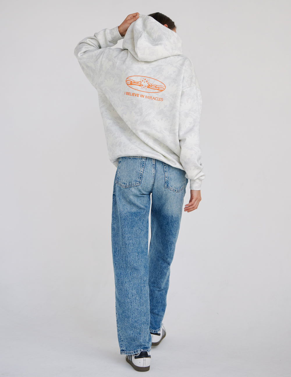 Light camo unisex hoodie with orange chest logo and kangaroo pocket