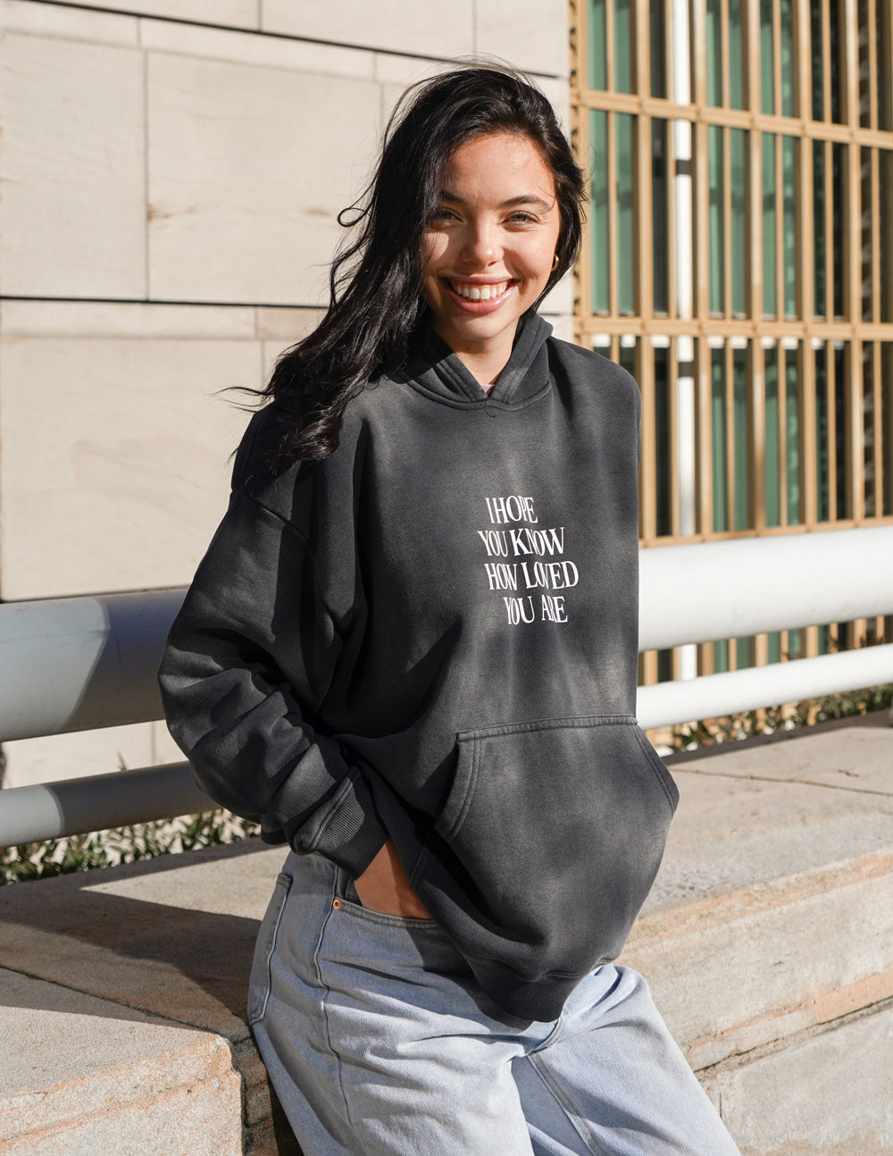 Dark unisex hoodie with front graphic print and hood