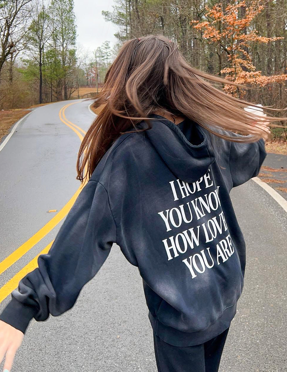 Dark unisex hoodie with large back graphic print and hood