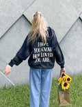 Dark unisex hoodie with large back graphic print and front kangaroo pocket
