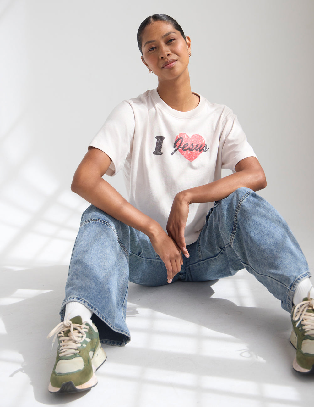 Cropped white women's tee with black I and red Jesus heart graphic