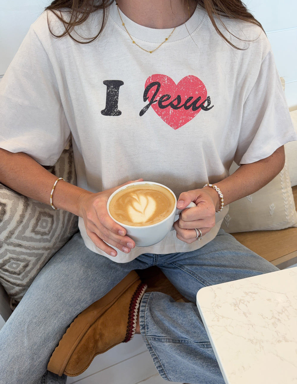 Cropped white women's tee front close-up with 'I Jesus' red heart print