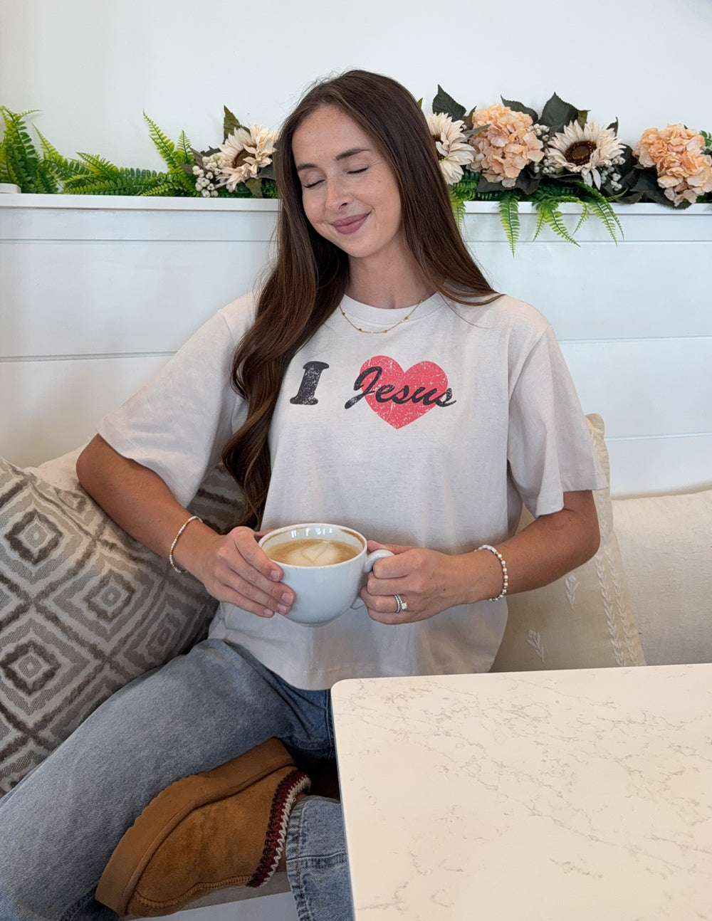 Cropped white women's tee on model with 'I Jesus' red heart chest graphic