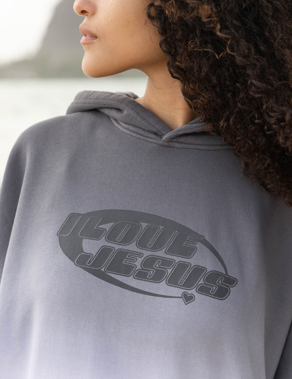 Unisex gray pullover hoodie with 'I Love Jesus' logo across chest