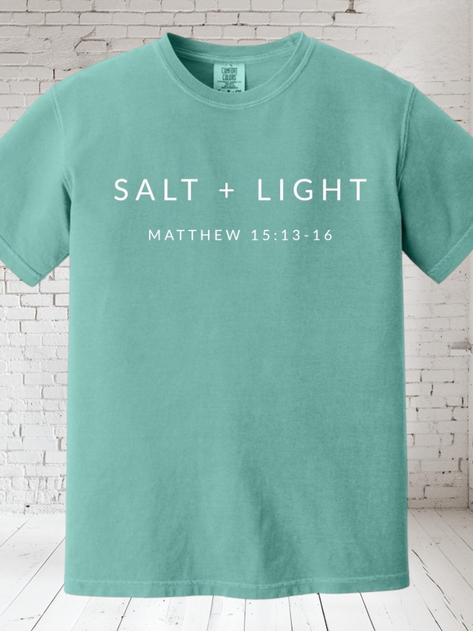 Mint T-shirt with 'SALT + LIGHT' and 'MATTHEW 15:13-16' on front