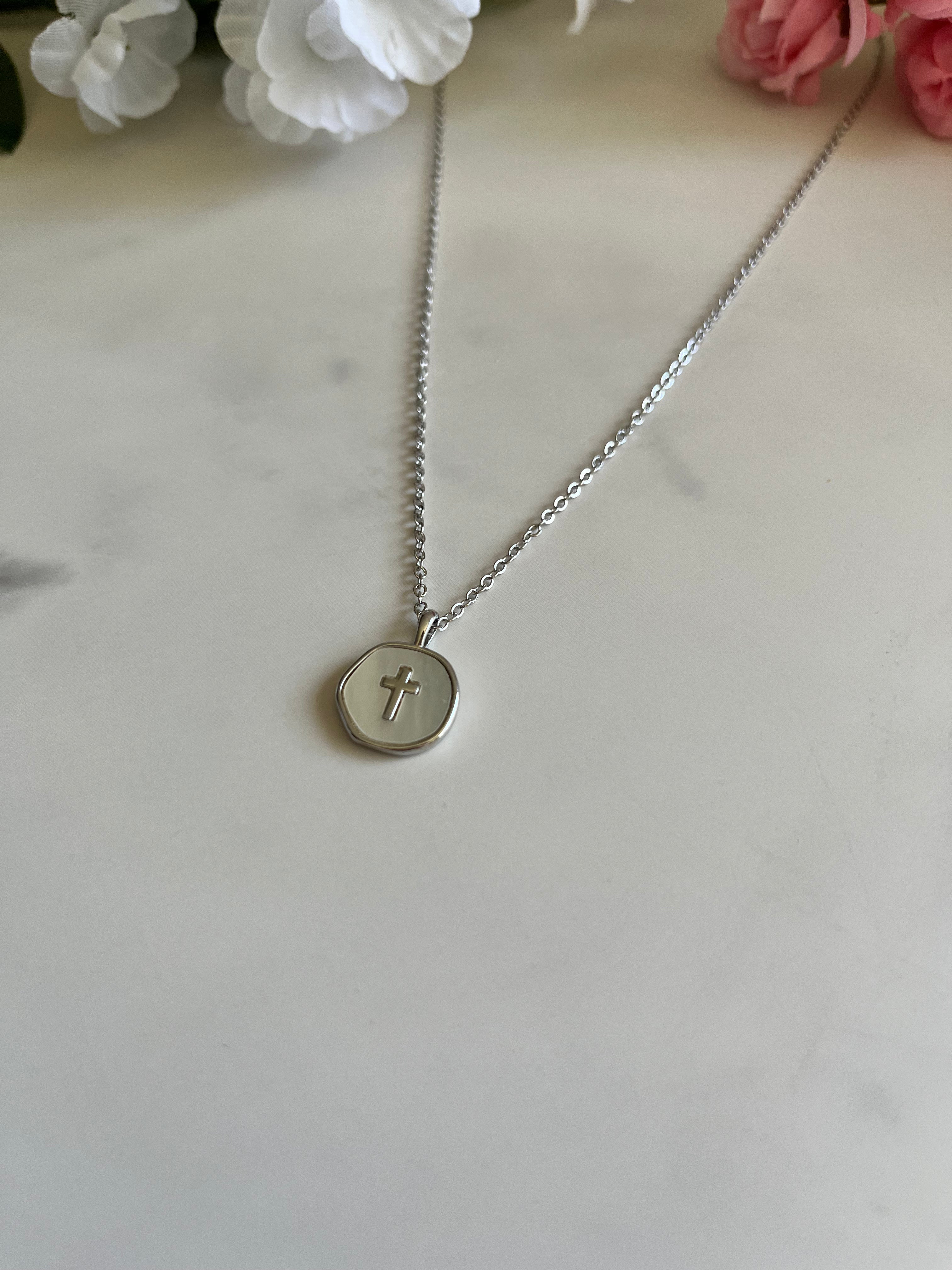 Silver round cross pendant necklace with slim chain and raised cross