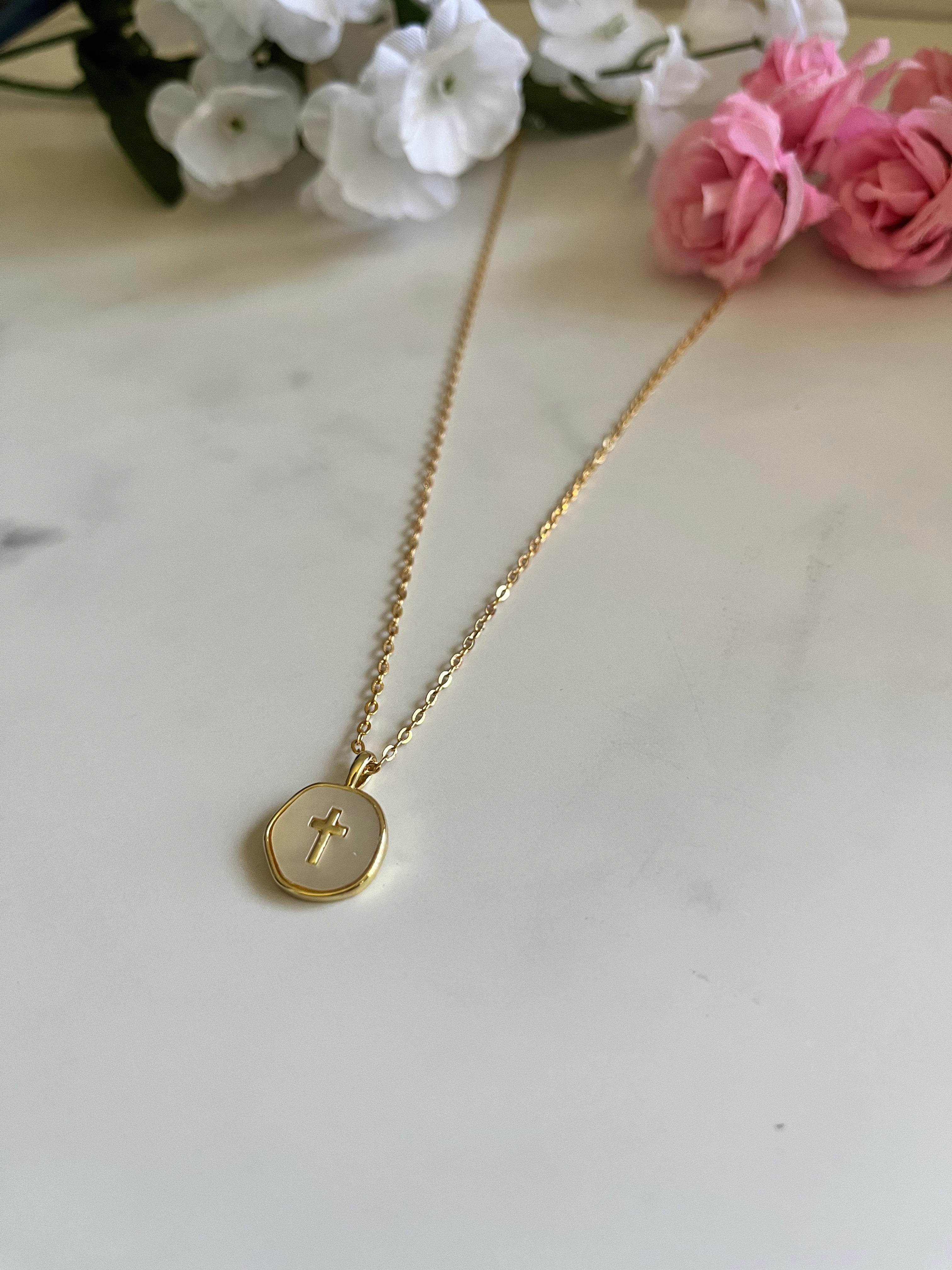 Gold round cross pendant necklace with thin chain and circular charm