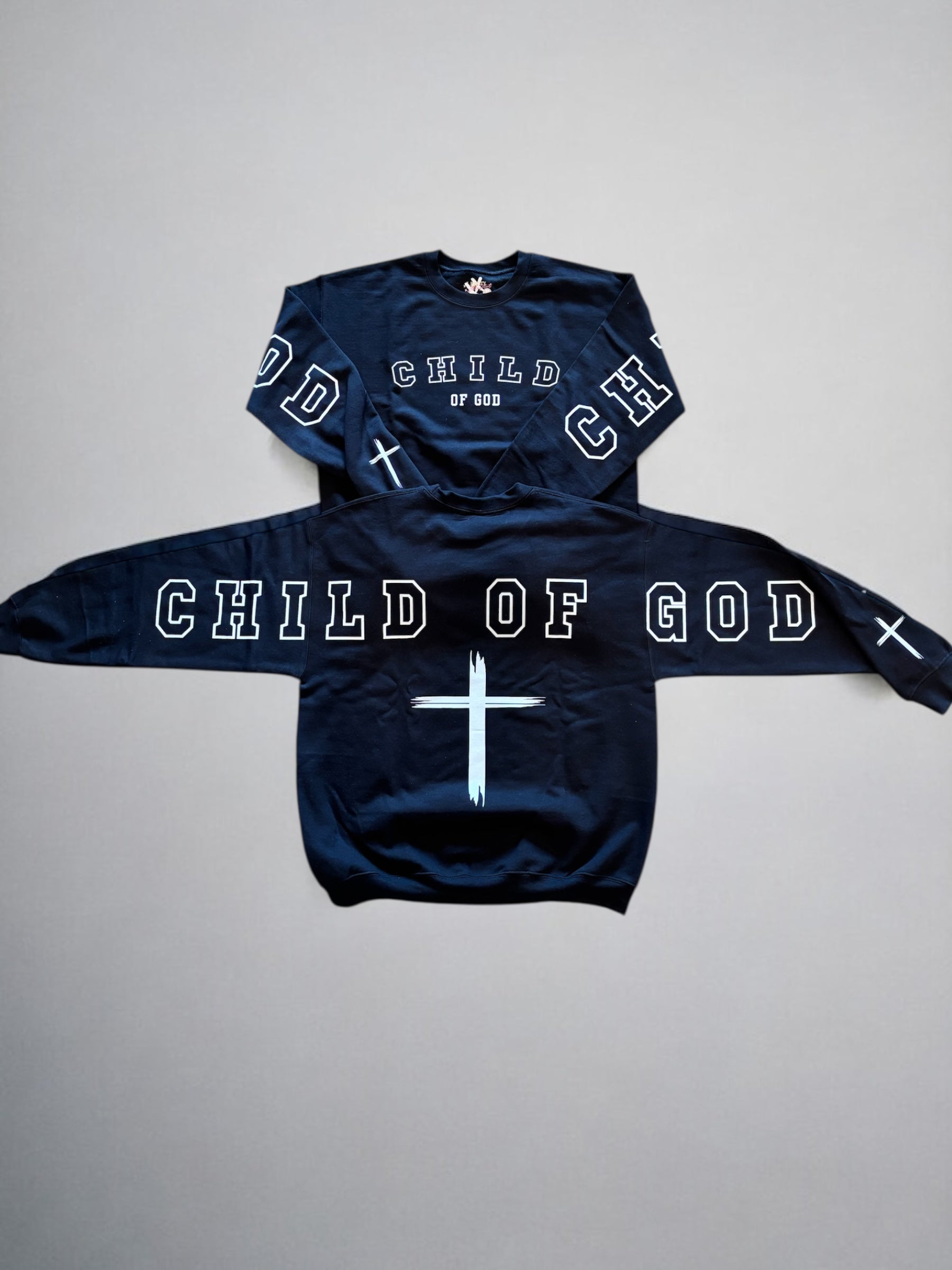 Child of God crewneck sweatshirt, dark navy with 'CHILD OF GOD' graphic