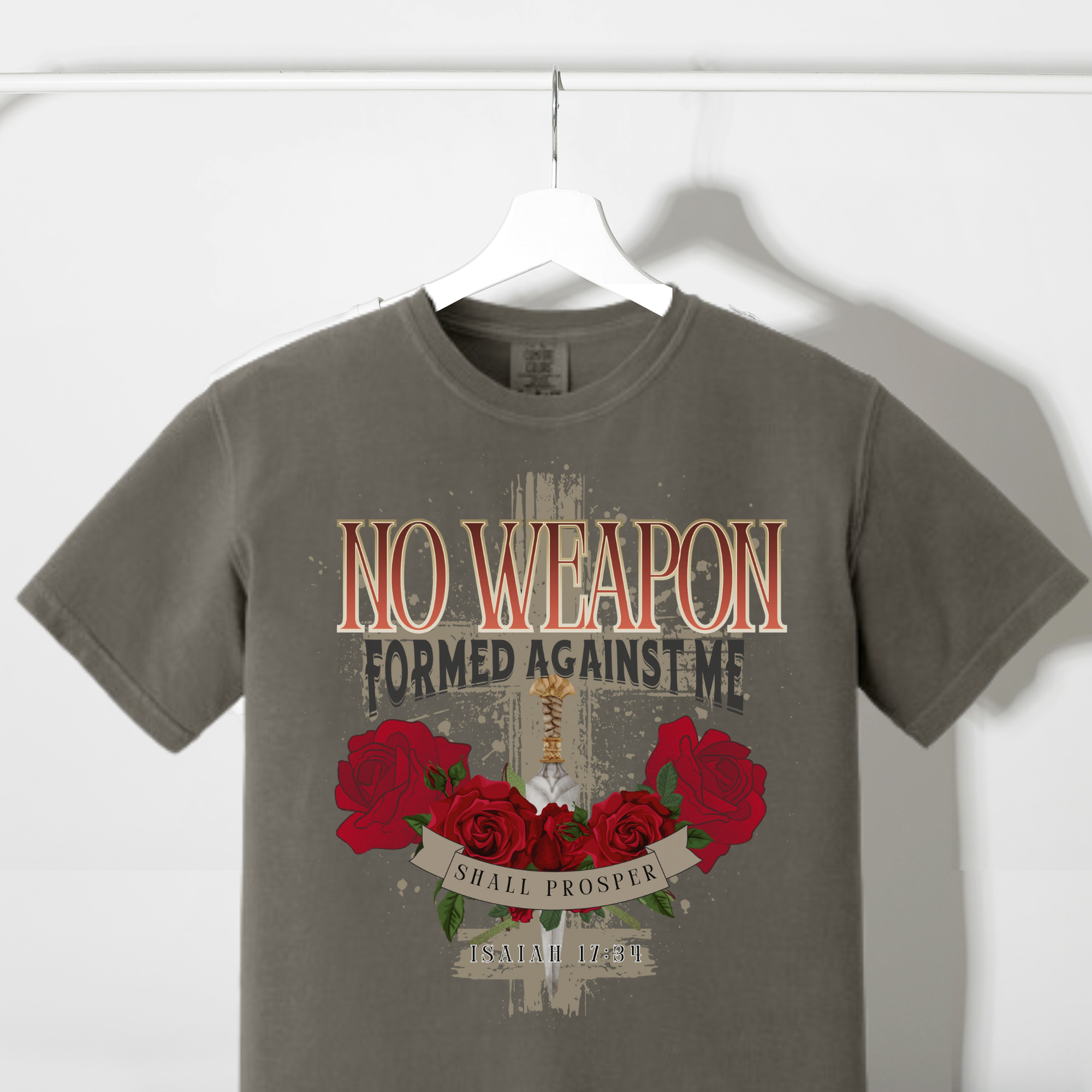 Dark gray graphic T-shirt with rose wreath and text “No weapon formed against me”