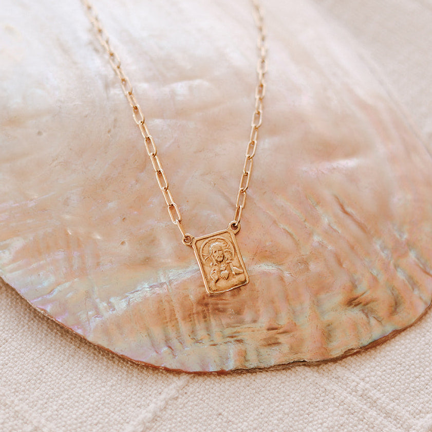 Gold paperclip scapular necklace with square portrait pendant on chain