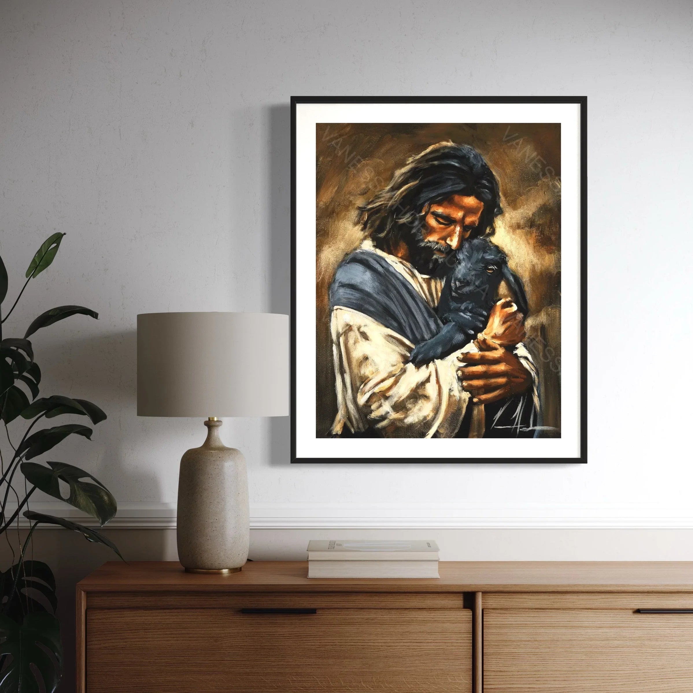 Framed giclée-style art print of a man holding a black dog, warm brown tones