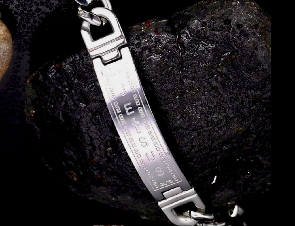 Silver-tone chain cuff bracelet close-up with engraved center and linked clasp