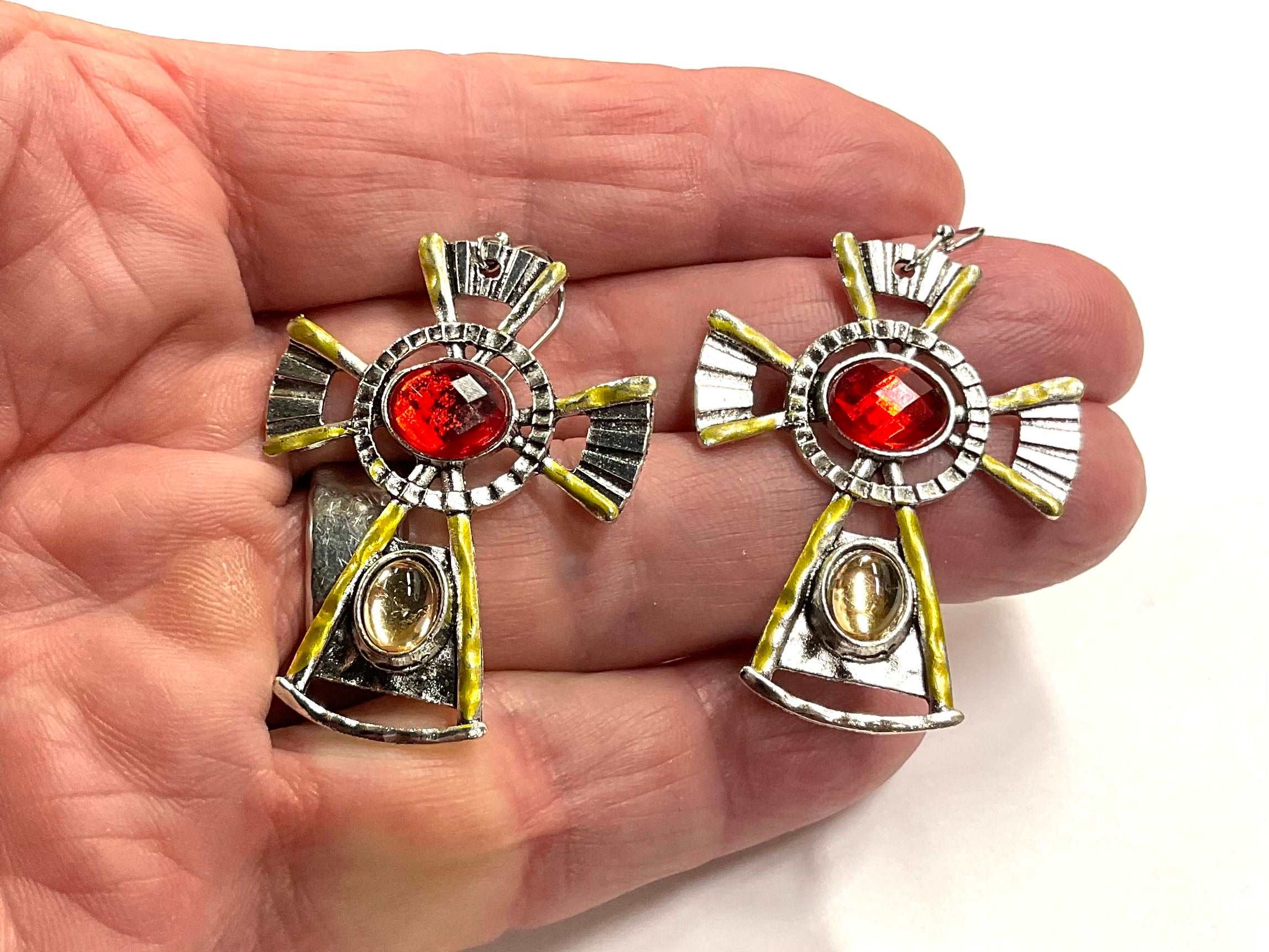 Cross dangle earrings with red cabochon center stones, gold-tone trims and hanging crosses