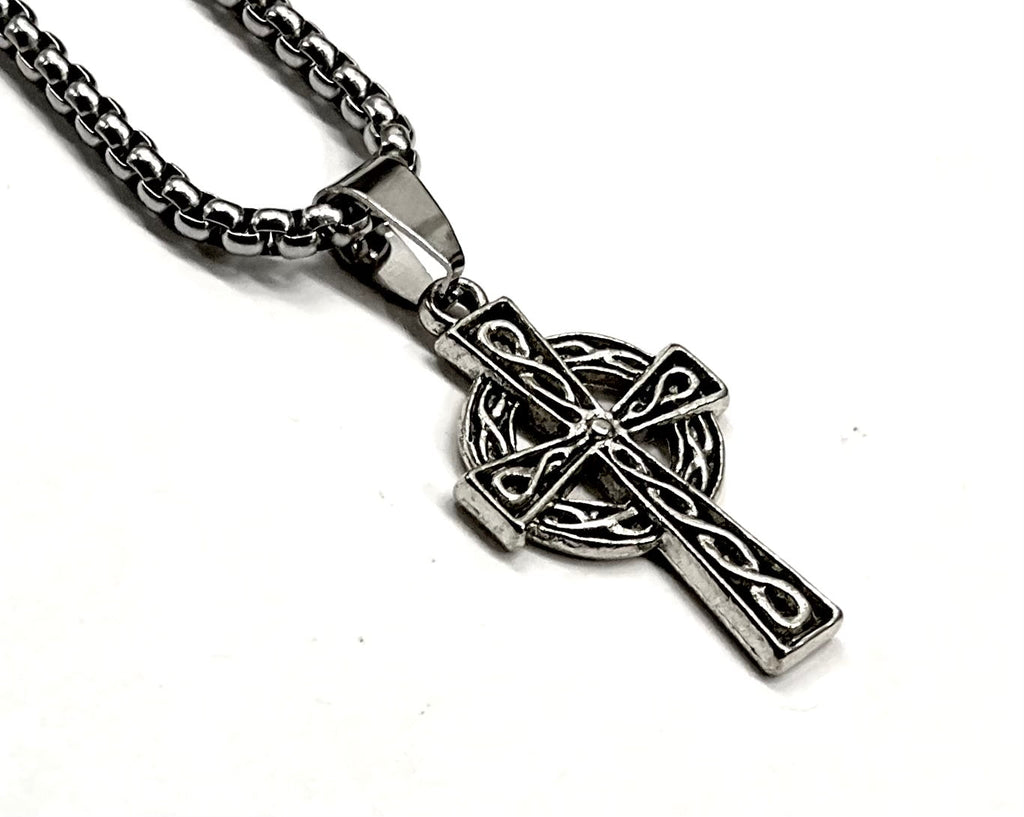 Silver crucifix cross pendant with Celtic knot design on link chain