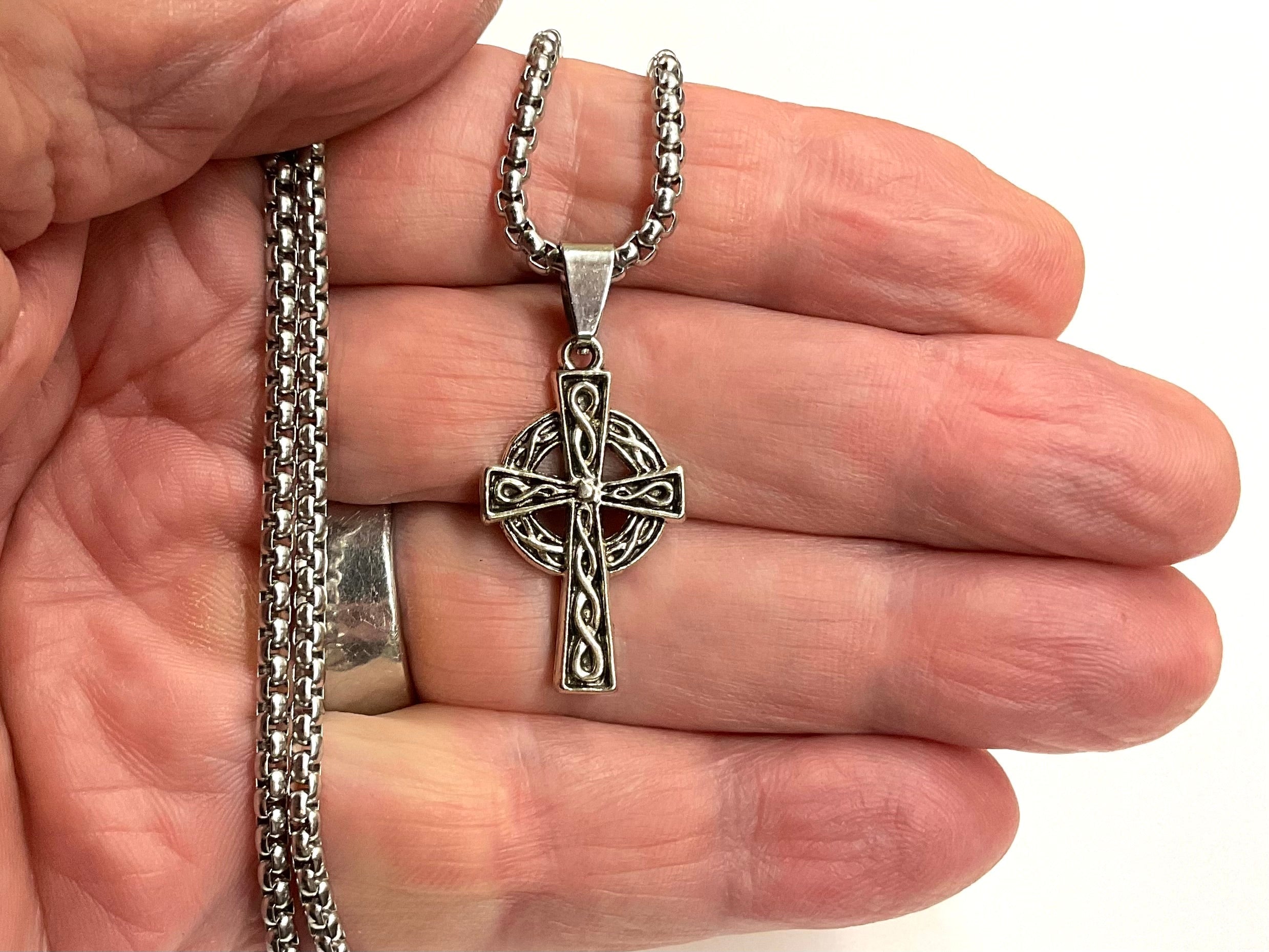 Silver cross necklace pendant with Celtic knot on thick link chain, hanging loop