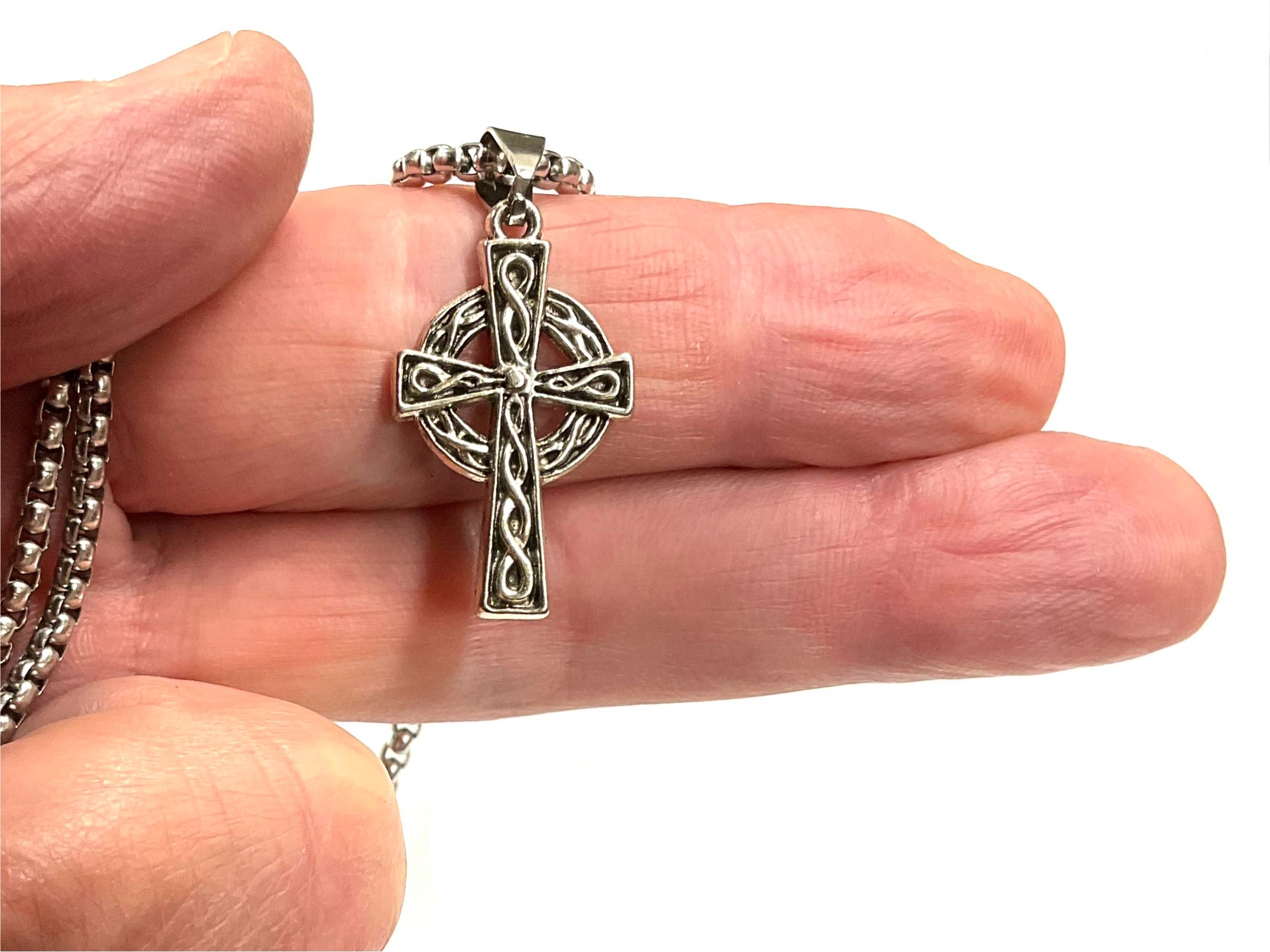Silver cross pendant with Celtic knot filigree on link chain, top clasp loop