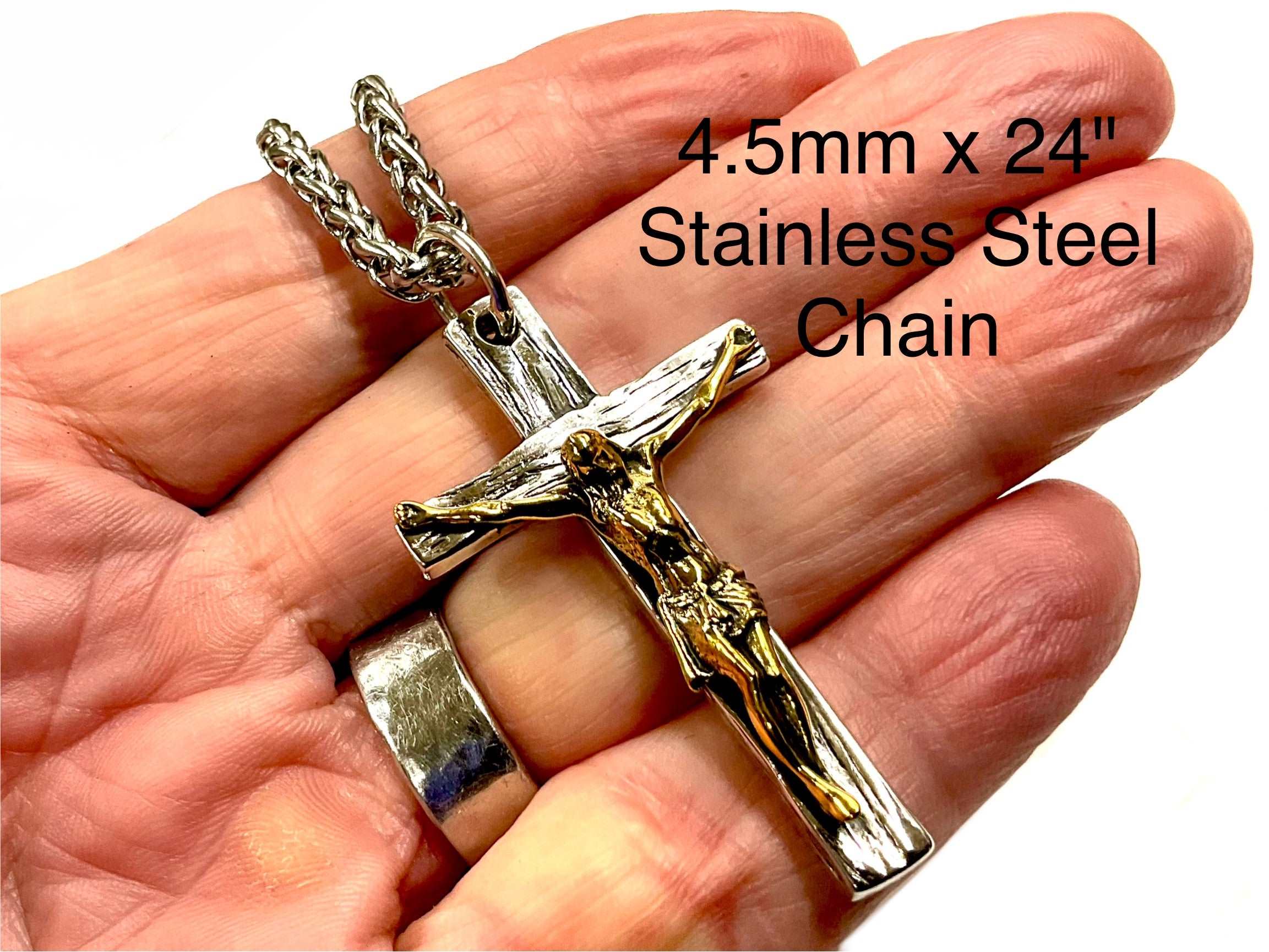 Silver cross necklace with gold-and-silver crucifix and chain links