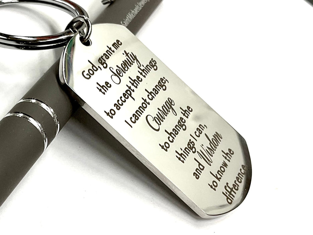 Silver dog tag keychain with Serenity Prayer lettering and split key ring, close-up