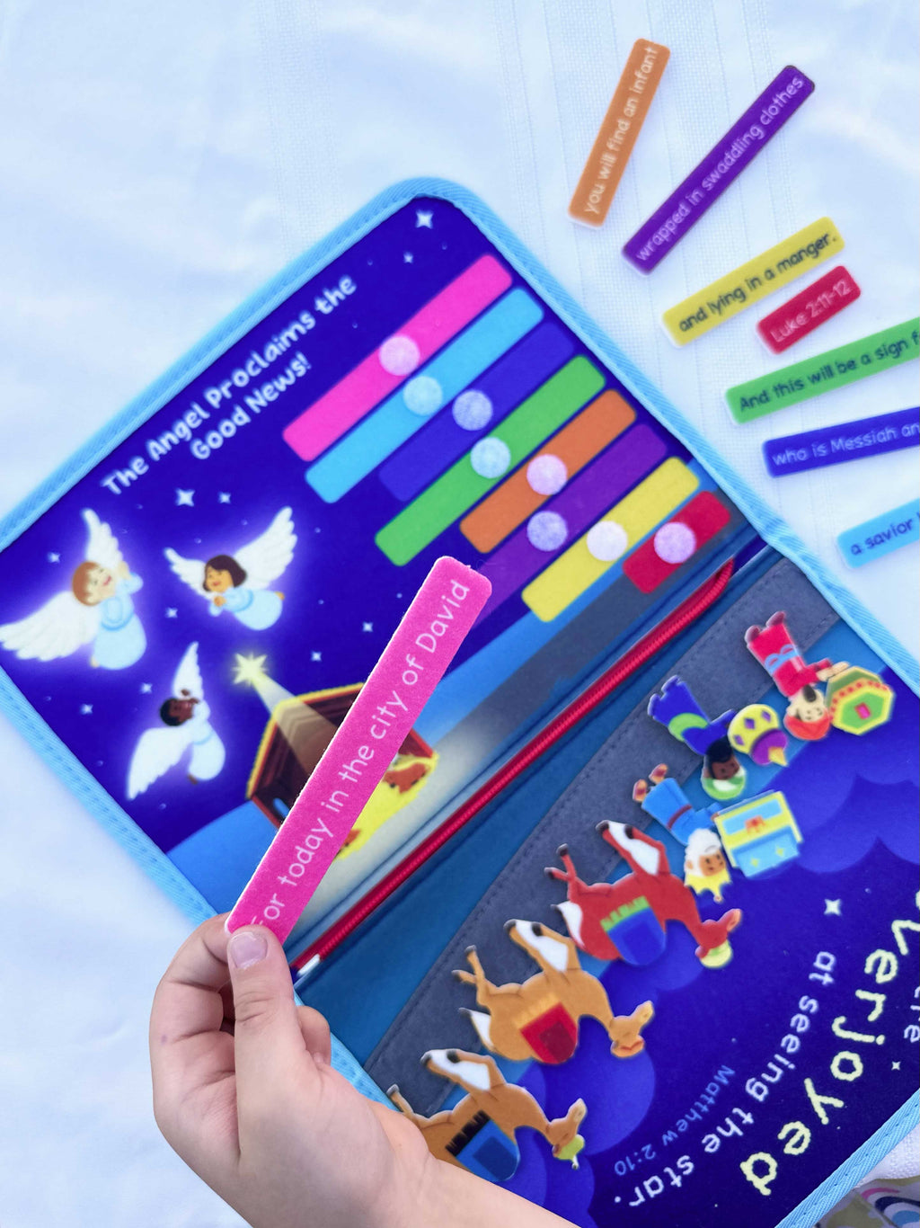 Nativity busy book open panel with colorful felt bars and angel decorations