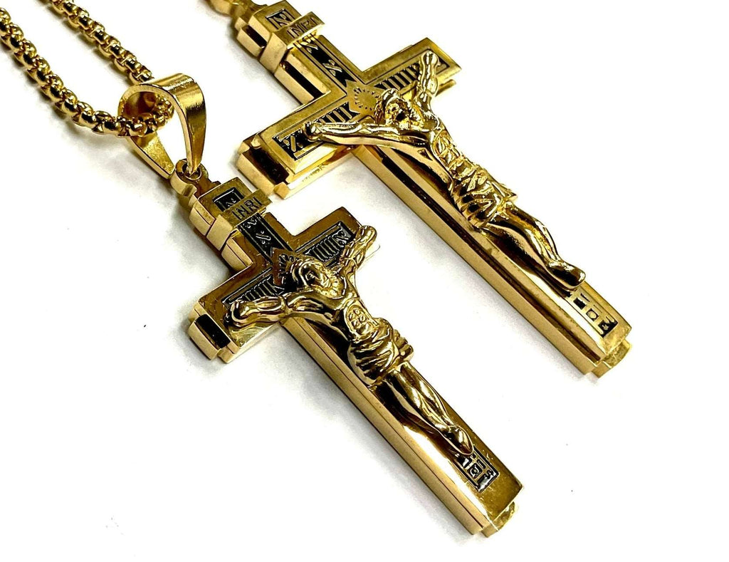 Gold cross crucifix necklace with two matching pendants on a chain