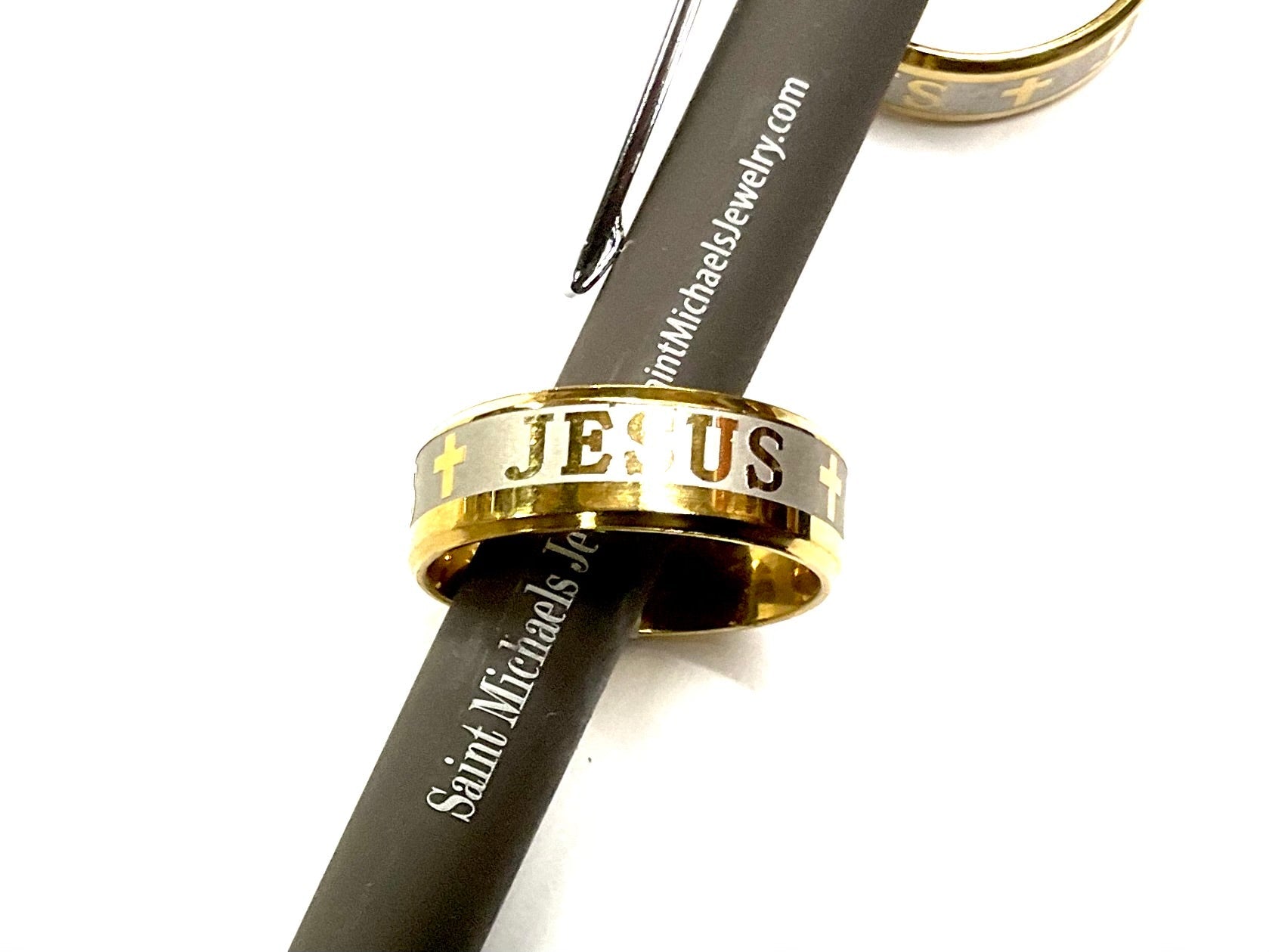 Gold wide stainless steel ring with cross and 'JE US' engraving on band