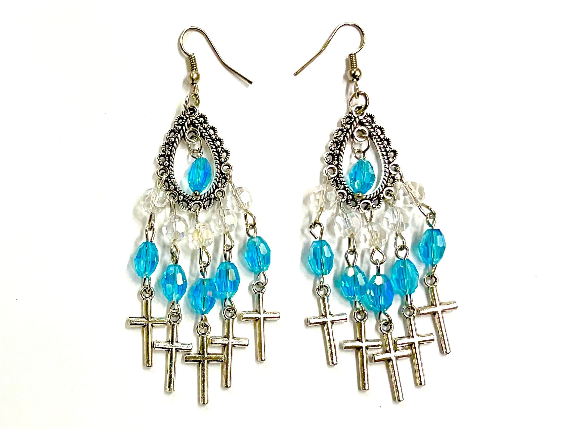 Silver cross chandelier earrings with oval blue glass stones and dangling beads