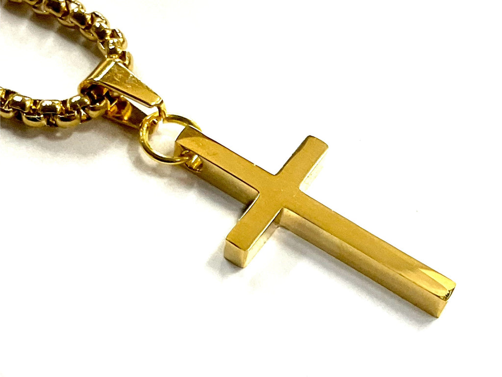 Gold metal cross pendant on link chain