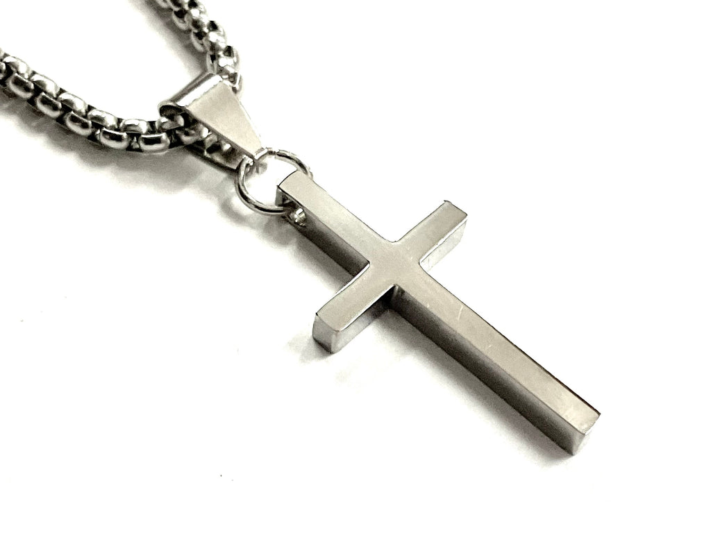 Silver metal cross pendant on link chain