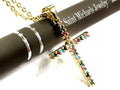Gold cross necklace with multicolor CZ stones on a chain, close-up view