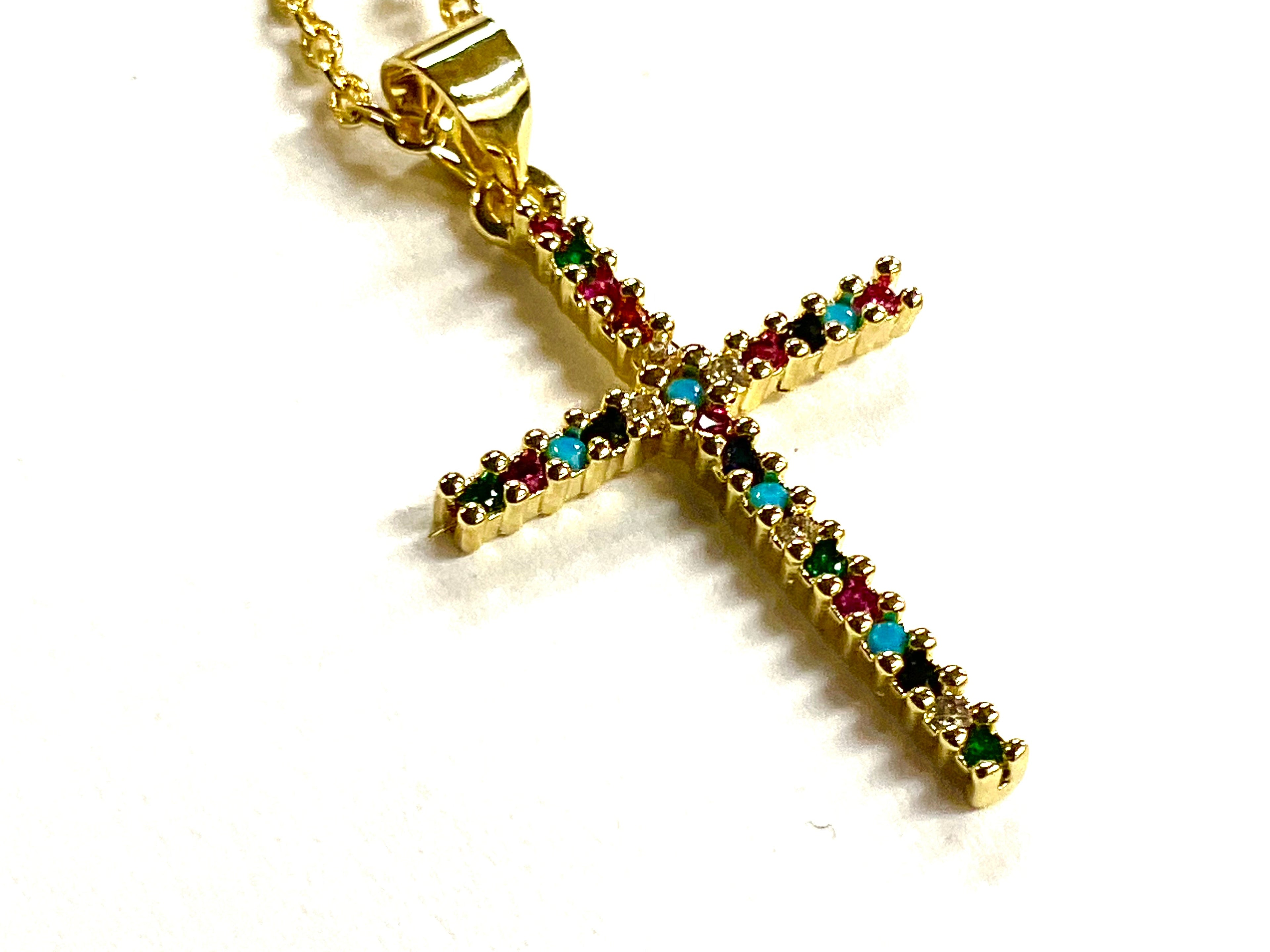 Gold cross pendant necklace with multicolor CZ stones on a gold chain